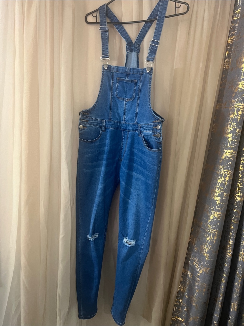 Women’s blue jean overalls.